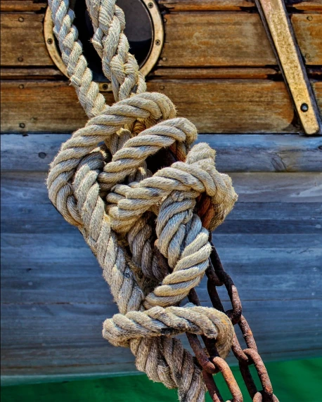 a close up of a rope on a boat, by Karl Hagedorn, flickr, romanticism, detailed wood, hdr detail, camaraderie, loosely cropped