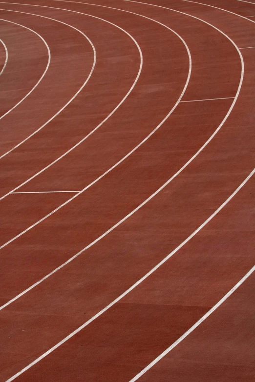 a man riding a skateboard on top of a track, synthetism, zoomed in shots, terracotta, wikimedia, stadium