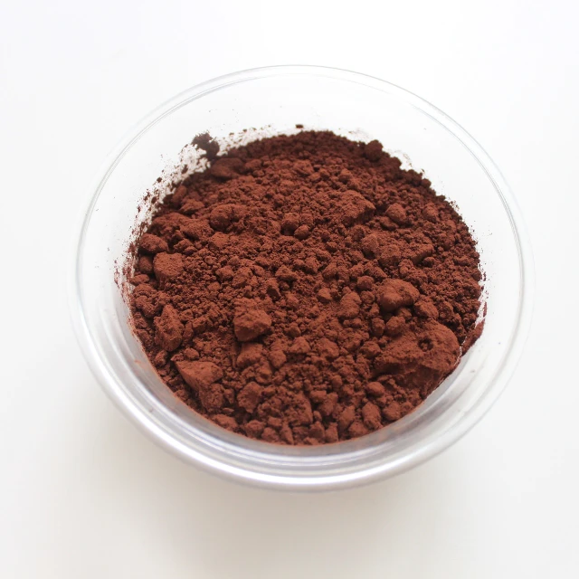 a bowl of cocoa powder on a white surface, by Liao Chi-chun, tumblr, red and brown color scheme, “ iron bark, martian, lulu chen