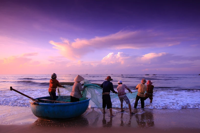 a group of people standing on top of a beach next to the ocean, a picture, by Dan Luvisi, shutterstock, process art, fishing boats, violet colored theme, vietnam, preparing to fight