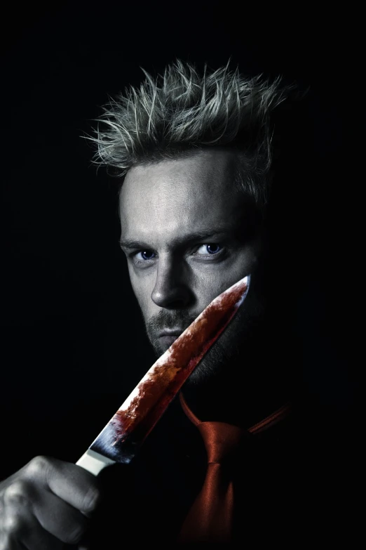 a man holding a knife in front of his face, a character portrait, by Jens Søndergaard, shutterstock, shock art, bride of chucky, izombie, one man is blond, still from the movie sharknado