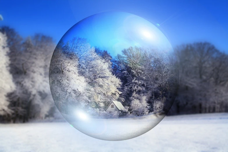 a soap bubble sitting on top of a snow covered field, a photo, inspired by Arthur Burdett Frost, magical realism, house in forest, modern very sharp photo