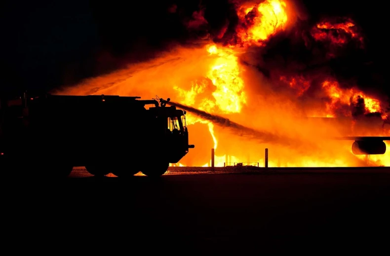 a fire truck spraying water on a large fire, a picture, by Bernie D’Andrea, pexels, auto-destructive art, profile picture 1024px, luminous fire halo, demolition, 2 0 1 0 photo