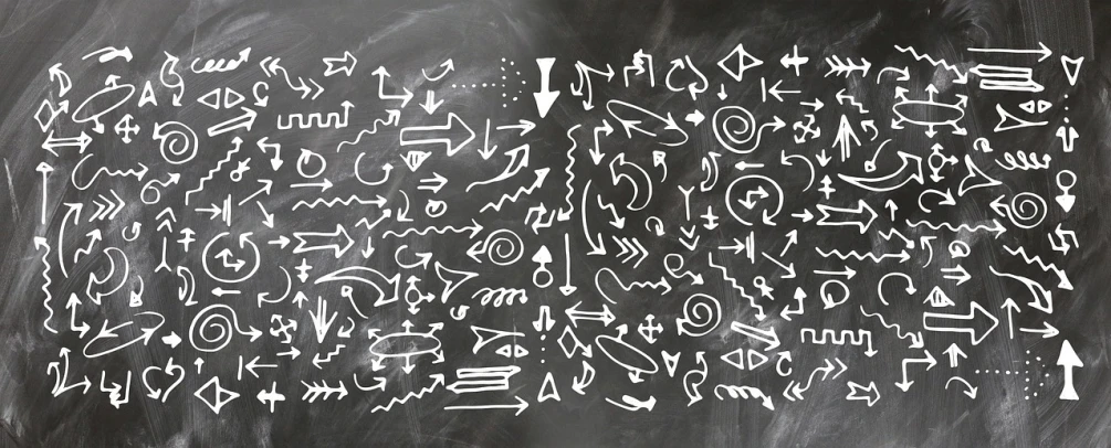 a close up of a chalk board with writing on it, pixabay, graffiti, ornamental arrows, black and white vector art, istockphoto, set pieces