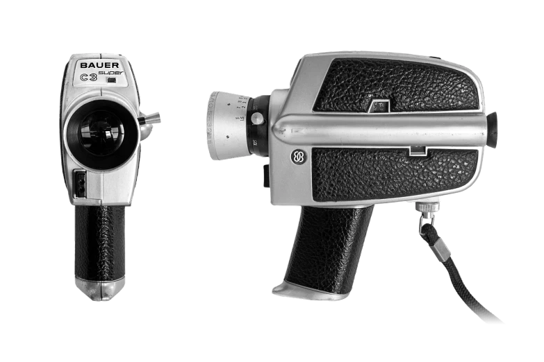 a black and white photo of a camera, a black and white photo, by Slava Raškaj, bauhaus, next to it is a toy ray gun, 1 4 mm, front and side view, camcorder