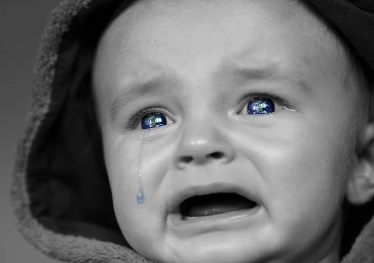 a black and white photo of a crying baby, a photo, with vivid blue eyes, sapphire, sad man, high res photo