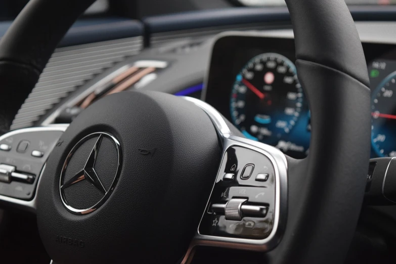 a close up of a steering wheel in a car, a picture, les automatistes, mercedez benz, rectangle, smooth lines, asymmetric