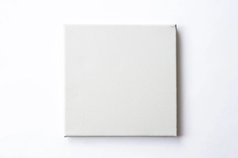 a white book sitting on top of a white surface, a minimalist painting, by Thomas de Keyser, unsplash, 144x144 canvas, flat grey color, miniature product photo, on white background