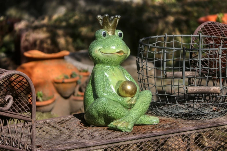 a statue of a frog sitting on top of a table, inspired by Ron English, large crown, pregnant, sitting in the garden, full res