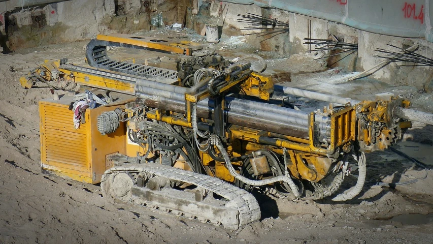 a machine that is sitting in the dirt, a portrait, pipes, boring, high quality product image”, a middle-shot from front