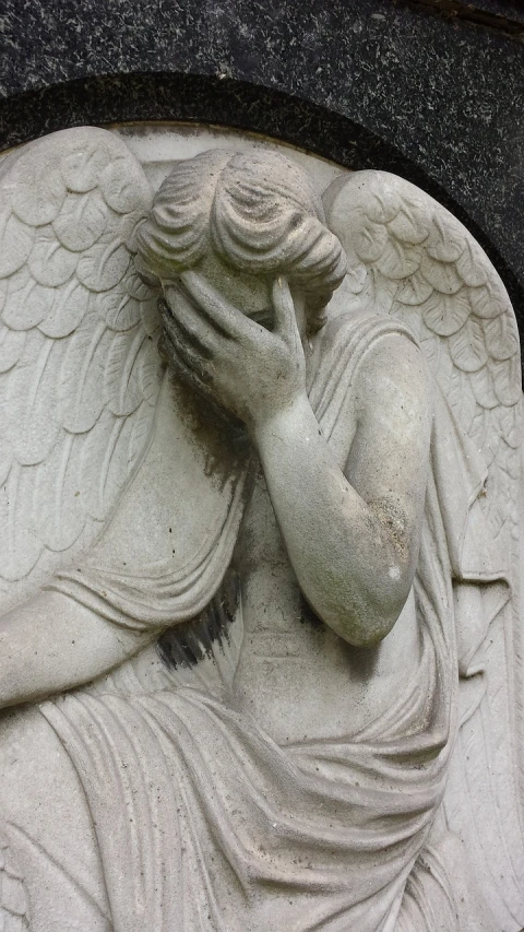 a close up of a statue of an angel, by Robert Brackman, flickr, concrete art, embarrassed, hand on his cheek, panel, phone photo