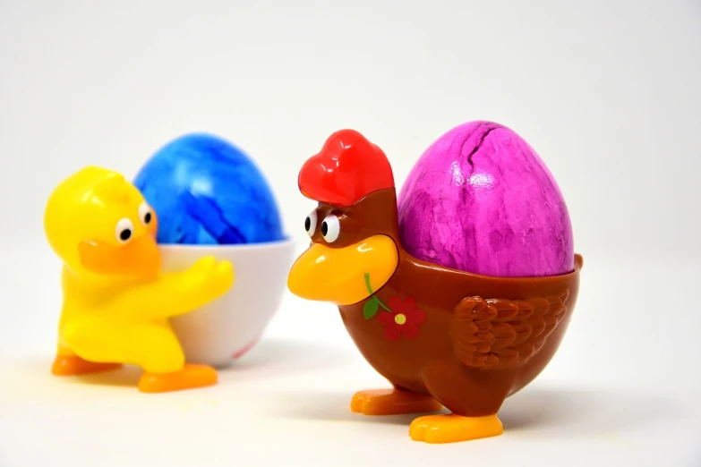 a couple of toys that are next to each other, a picture, pixabay, he has a big egg, daffy duck, chocolate, cool marketing photo