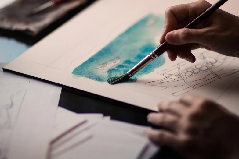 a person is drawing on a piece of paper, a watercolor painting, inspired by artist, pexels, arbeitsrat für kunst, 🎨🖌, awesome art, deep blue water color, courtroom drawing