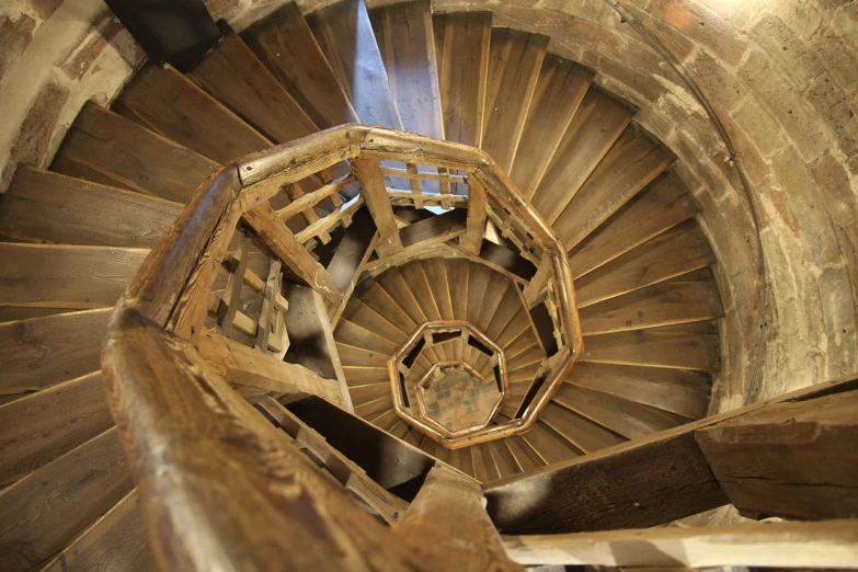 a close up of a spiral staircase in a building, by Viktor de Jeney, flickr, renaissance, bruegels the tower of babel, wooden stairs, high - angle view, of a old 13th century