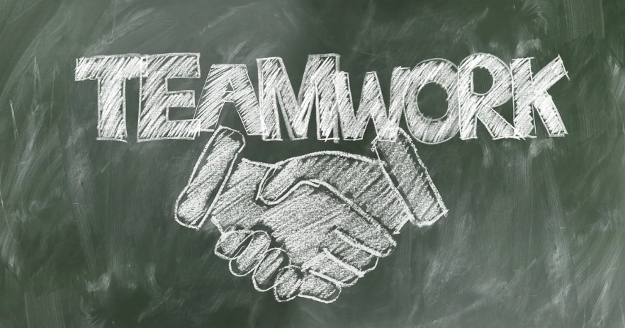 a blackboard with the word teamwork written on it, an engraving, by Emma Andijewska, trending on pixabay, graffiti, shaking hands, ergodox, phlegm, competition