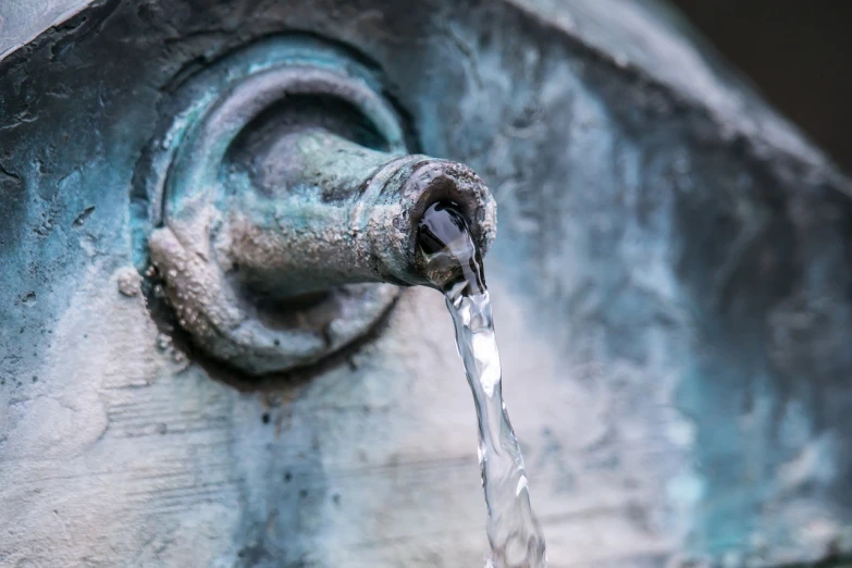 a close up of a faucet with water coming out of it, by Cherryl Fountain, shutterstock, renaissance, verdigris, high details photo