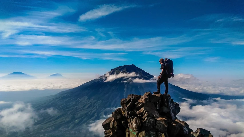 a man standing on top of a mountain with a backpack, a picture, by Erik Pevernagie, sumatraism, avatar image, mount doom, panoramic view of girl, sense of scale and awe