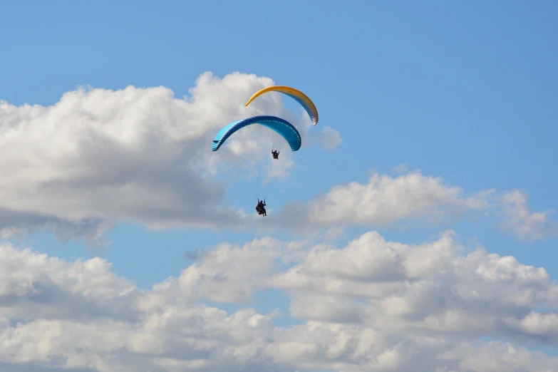a couple of people that are flying in the sky, flickr, beautiful black blue yellow, pod, usa-sep 20, tourist photo