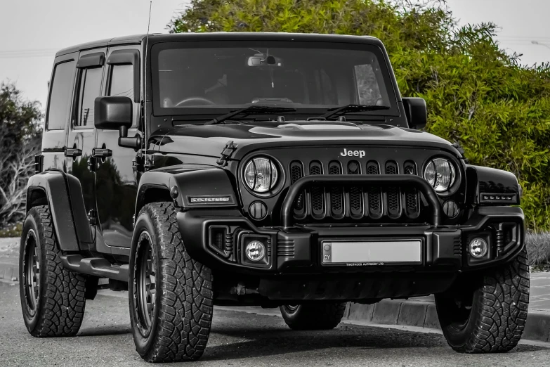 a black jeep parked on the side of the road, pixabay, fully armoured, symmetrical front, jk, award-winning style