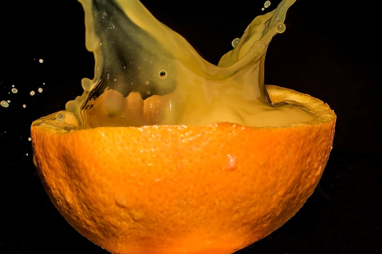 a close up of an orange with a splash of liquid, by Jan Rustem, orange demons, unlimited juice, f / 2. 8, crazy fun