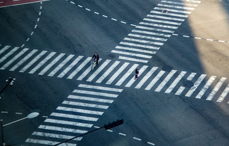 a couple of people that are walking across a street, by Hiroshi Honda, precisionism, stripes, cross hatch, tokyo prefecture, lonely rider