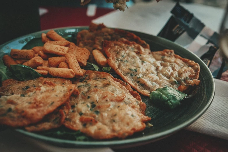 a close up of a plate of food on a table, unsplash, dau-al-set, battered, sri lanka, retro effect, 🦩🪐🐞👩🏻🦳