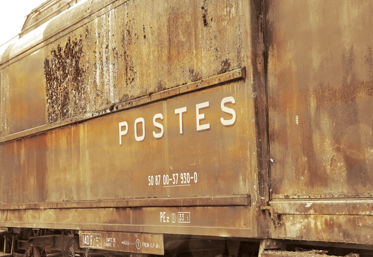 a rusty train car with the word postes written on it, a poster, by Kurt Roesch, postminimalism, photorealism. trending on flickr, stacked image, delivering mail, petite