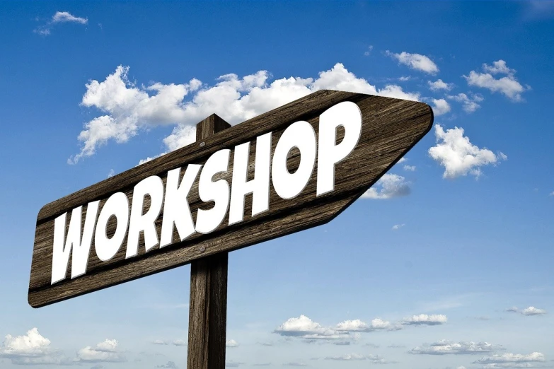 a wooden sign with the word workshop written on it, pixabay, digital art, “puffy cloudscape, document photo, flash photo, blue sky