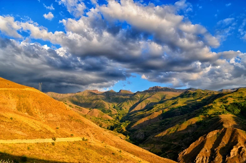 a view of the mountains from the top of a hill, by Muggur, shutterstock, late afternoon lighting, kurdistan, new zealand landscape, summer afternoon