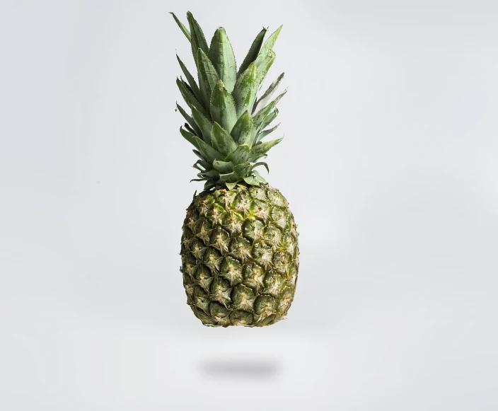 a pineapple floating in the air on a white background, a stock photo, by Simon Gaon, hyperrealism, cinematic shot, on a gray background, amazing simple composition, he is about 60 years old