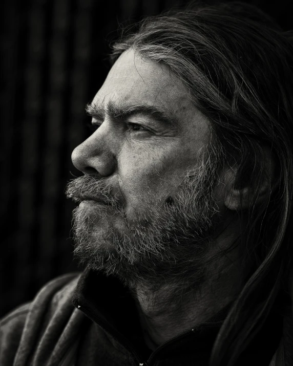 a black and white photo of a man with long hair, a character portrait, by Andrew Geddes, unsplash, matt berry, old man portrait, donald trump as a homeless man, profile portrait