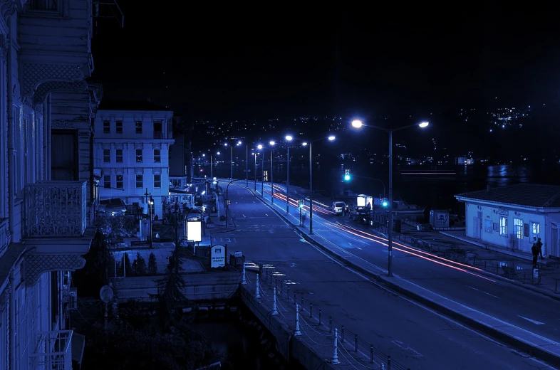 a city street filled with lots of traffic at night, by Yasar Vurdem, flickr, realism, dark blue tones, aykut aydogdu zener, victorian harbour night, empty street