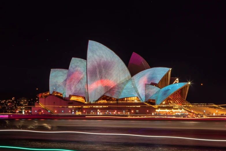 the sydney opera house lit up at night, a hologram, pexels contest winner, art nouveau, timelapse, long exposure photo, colorful chromatic abberation, 2 0 2 2 photo
