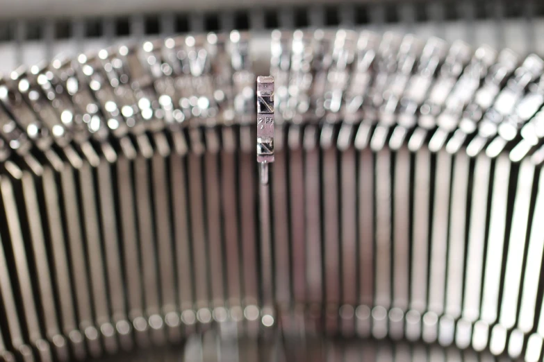 a close up of a close up of a typewriter, a macro photograph, by Julian Allen, photorealism, shiny silver, jukebox, needles, clear detailed view