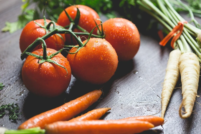 a bunch of tomatoes and carrots on a table, by Matt Cavotta, background image, loosely cropped, rain lit, motivational