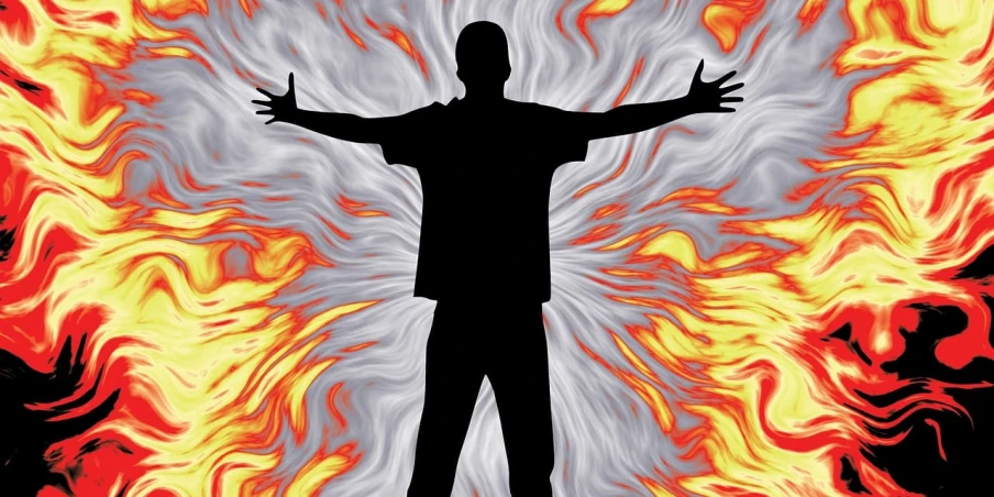 a man that is standing in front of a fire, inspired by Rodney Joseph Burn, pixabay, shock art, energy vortex, plain background, 7 feet tall, stock photo