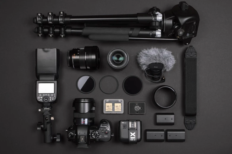 the contents of a camera laid out on a table, by Daren Bader, minimalism, detailed 8k, black color scheme, extremely detailed + 8k, professional
