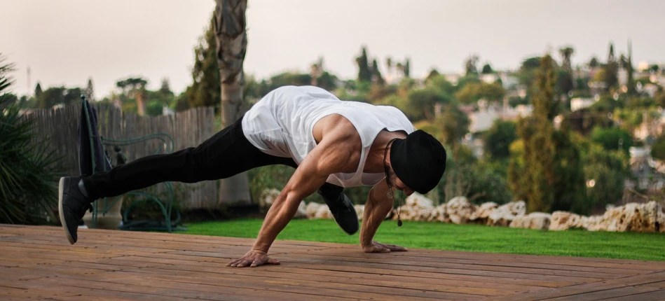 a man doing a handstand on a wooden deck, by Steven Belledin, arabesque, ernest khalimov body, gal yosef, tank with legs, outside