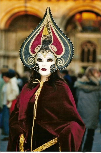 a close up of a person wearing a costume, by Kurt Wenner, flickr, baroque, venetian mask, european woman photograph, photo taken with ektachrome, pointy conical hat