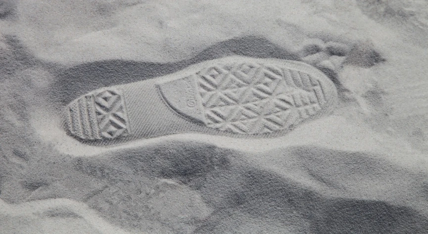 a shoe imprint in the sand on a beach, a stipple, unsplash, escher style, gray canvas, highly detailed product photo, rubber waffle outsole