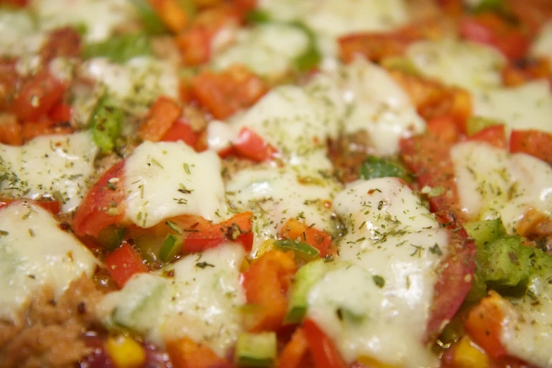 a pizza sitting on top of a pan covered in cheese, by Aleksander Gierymski, shutterstock, ratatouille style, closeup - view, high details photo, vegetables