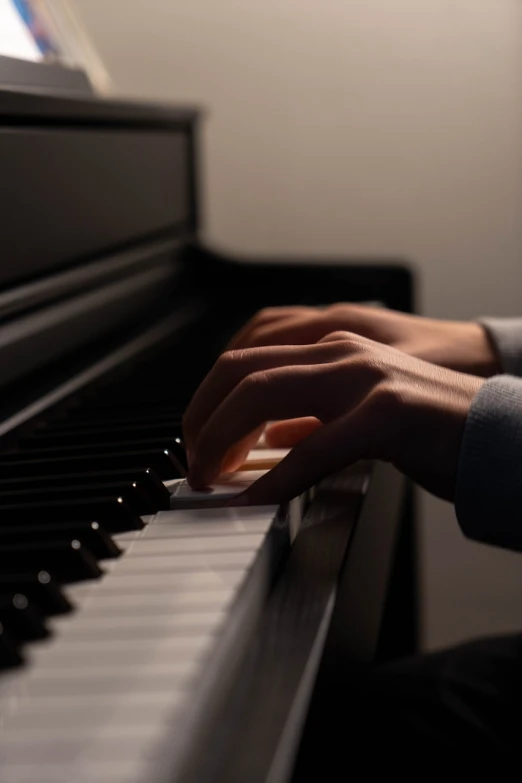 a close up of a person playing a piano, inspired by Kawai Gyokudō, realistic soft lighting, right hand side profile, with professional lighting, 4 0 9 6