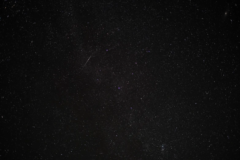 a night sky filled with lots of stars, a picture, minimalism, shooting star in background, wide shot photo