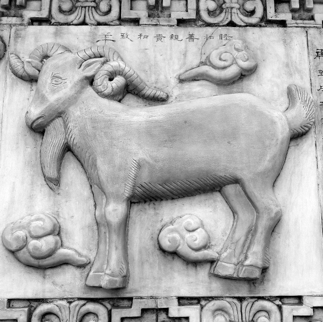 a black and white photo of a ram on a building, inspired by Luo Mu, panel, qiangshu, unknown zodiac sign, monochrome:-2