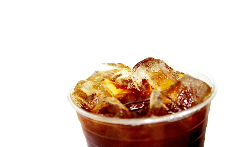 a close up of a drink in a plastic cup, a stock photo, cold brew coffee ), high key detailed, ice cubes, shallow dof