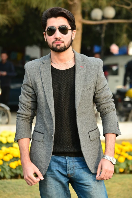 a man standing with his hands in his pockets, inspired by Nadim Karam, pexels, neo-dada, wearing a blazer, tehran, full body:: sunny weather::, fashionable haircut