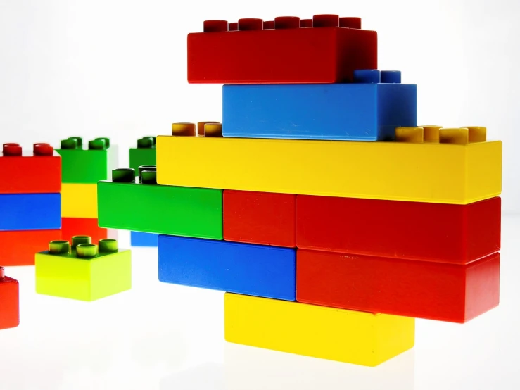 a pile of lego blocks sitting on top of each other, by Paul Emmert, constructivism, cloud, primary color scheme, wide screenshot, product introduction photo