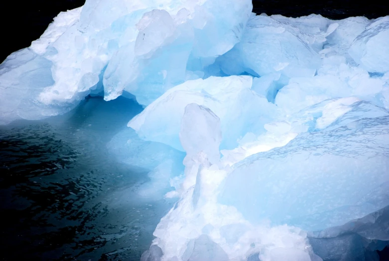 a group of icebergs floating in a body of water, plasticien, depth of field ”, ice seracs, high res photo