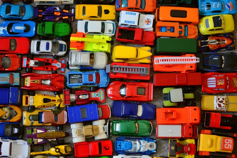 a pile of toy cars sitting on top of a table, pexels, maximalism, full of colour 8-w 1024, [ overhead view ]!!, photorealism. trending on flickr, munich