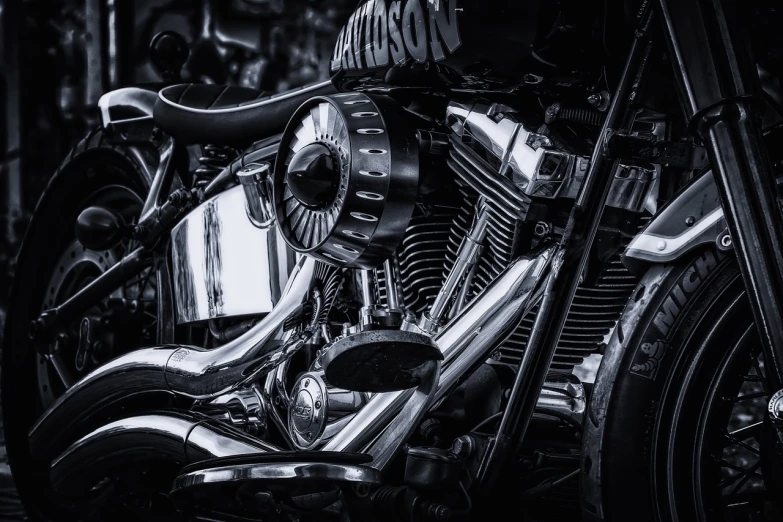 a black and white photo of a motorcycle, by Leo Michelson, pexels contest winner, photorealism, intricate detail realism hdr, smooth shiny metal, harley davidson, blue metal